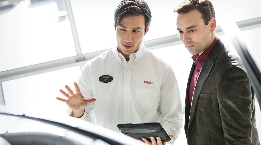 Sales person giving information to customer