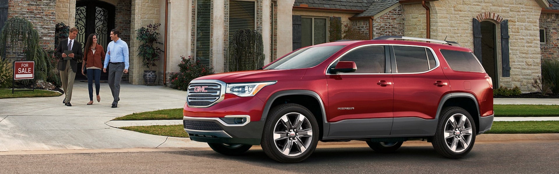 Acadia 2018 Red parked outside with two men girl